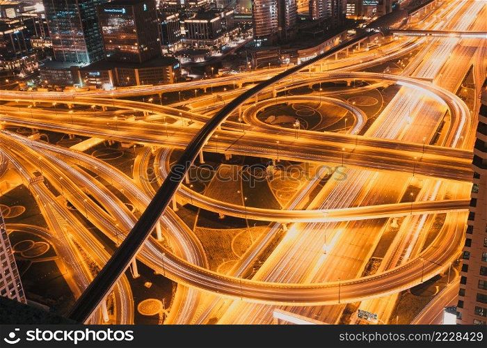 DUBAI, UAE - FEBRUARY 2018  Night traffic on a busy intersection on Sheikh Zayed highway