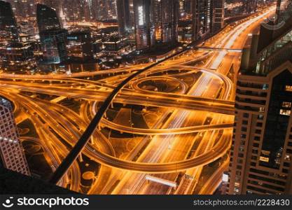 DUBAI, UAE - FEBRUARY 2018  Night traffic on a busy intersection on Sheikh Zayed highway