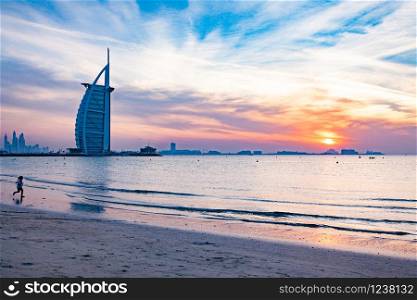DUBAI, UAE - FEBRUARY 2018 :The world&rsquo;s first seven stars luxury hotel Burj Al Arab at night seen from Jumeirah public beach in Dubai, United Arab Emirates