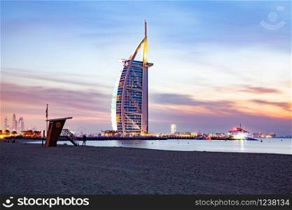 DUBAI, UAE - FEBRUARY 2018 :The world&rsquo;s first seven stars luxury hotel Burj Al Arab at night seen from Jumeirah public beach in Dubai, United Arab Emirates
