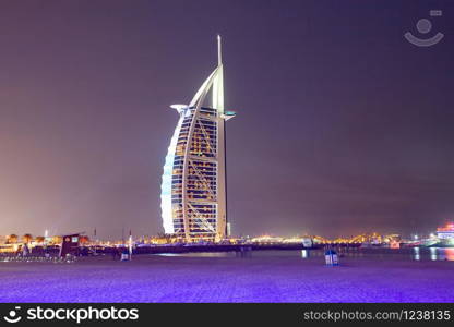 DUBAI, UAE - FEBRUARY 2018 :The world&rsquo;s first seven stars luxury hotel Burj Al Arab at night seen from Jumeirah public beach in Dubai, United Arab Emirates