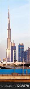 Dubai, UAE - FEBRUARY 2018:Vertical panorama of Burj Khalifa as viewed from the Dubai water canal