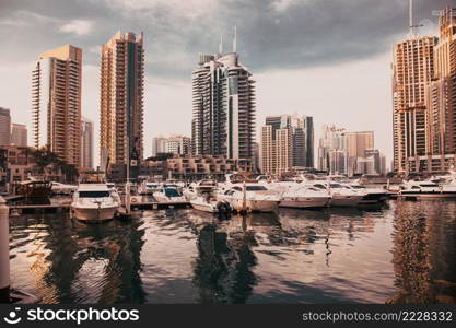 DUBAI, UAE - FEBRUARY 2018  View of modern skyscrapers shining in sunrise lights  in Dubai Marina in Dubai, UAE.