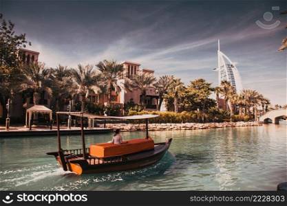DUBAI, UAE - FEBRUARY, 2018  View on Burj Al Arab, the world only seven stars hotel seen from Madinat Jumeirah, a luxury resort which include hotels and souk spreding across over 40 hectars.
