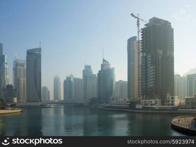 DUBAI, UAE - NOVEMBER 13: Modern buildings in Dubai Marina, on November 13, 2012, Dubai, UAE. Dubai was the fastest developing city in the world between 2002 and 2008.