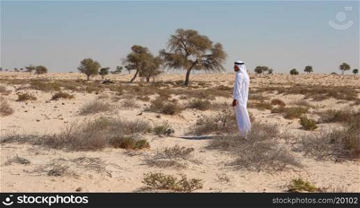 DUBAI, UAE-NOVEMER 7, 2013: Arab man in desert