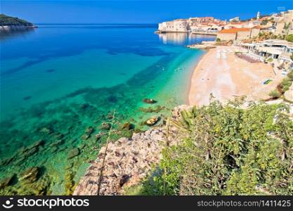 Dubrovnik. Banje beach and historic walls of Dubrovnik view, famous destination in Dalmatia region of Croatia
