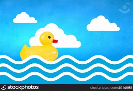 Duck toy. Yellow rubber duck toy floating in water