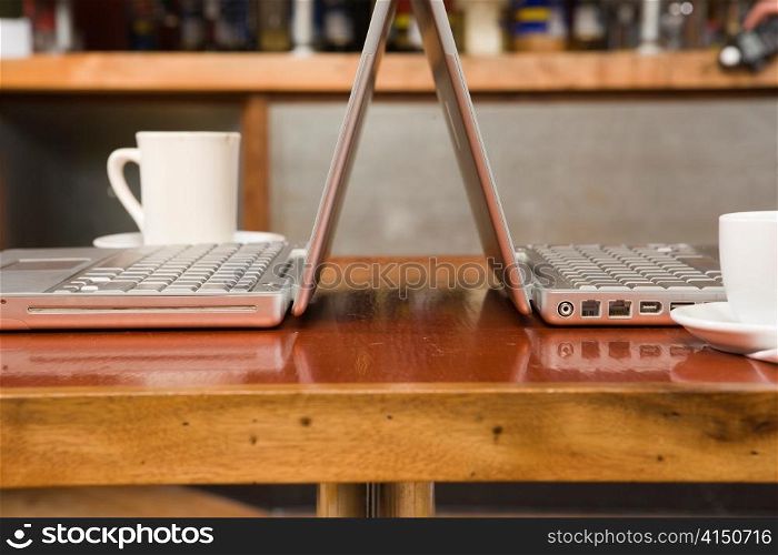 Dueling Laptops and Coffee Cups