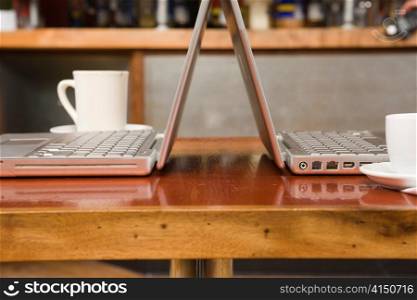 Dueling Laptops and Coffee Cups