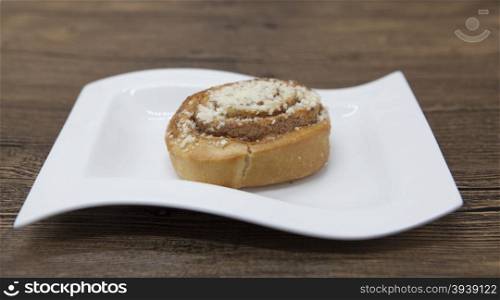 Dukan Diet. Fresh delicious diet cake at Dukan Diet on a porcelain plate with a spoon on a wooden background.. Dukan Diet. Fresh delicious diet cake at Dukan Diet on a porcelain plate with a spoon on a wooden background