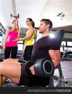 Dumbbell man at gym workout fitness weightlifting and dumbbell women personal trainer