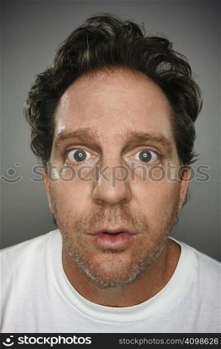 Dumbfounded Looking Man on a Grey Background
