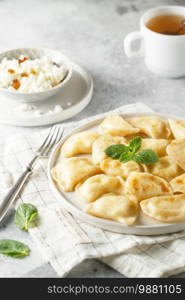 Dumplings, filled with cottage cheese. Russian, Ukrainian or Polish dish  varenyky, vareniki, pierogi, pyrohy. 