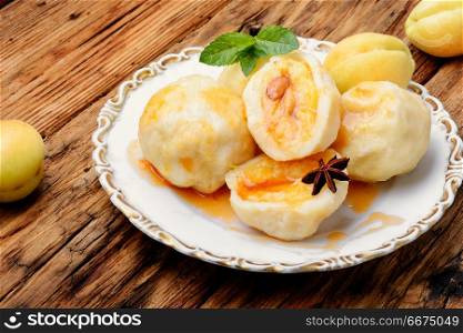 Dumplings with apricot and spicy syrup. National dish of Czech and Slovak cuisine of dumplings with apricot