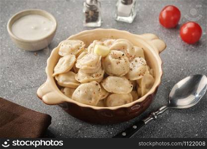 Dumplings with filling. Homemade meat dumplings - russian pelmeni. Dumplings, filled with meat, ravioli.