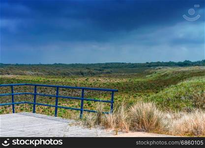 Dunes Panorama on the North Sea coast in Holland with dramatic sky