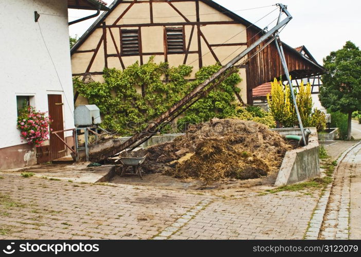 dung heap with crane