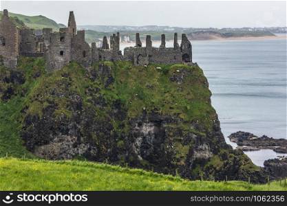 Dunluce Castle - the ruins of an early 13th century medieval castle in County Antrim, Northern Ireland.