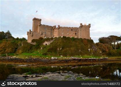 Dunvegan castle surrounded by Dunvegan loch.