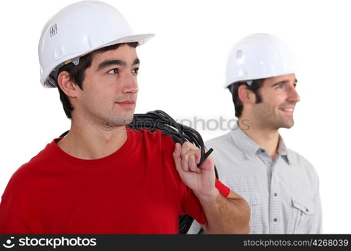 duo of electricians in studio