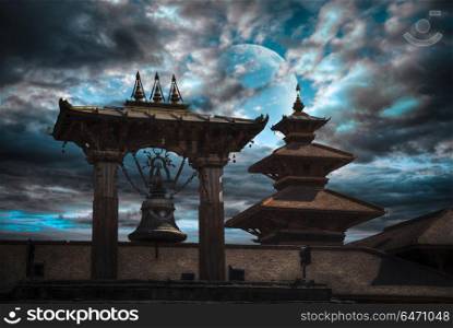 Durbar Square in the center of Kathmandu, Nepal. At night against the background of the moon. Durbar Square in the center of Kathmandu