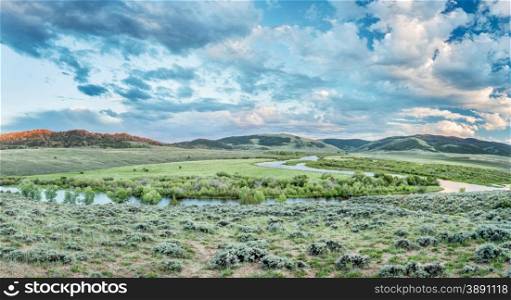dusk over North Platte River in Colorado North park above Northgate Canyon, early summer scenery - panorama