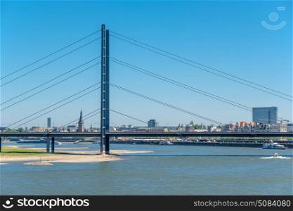 Dusseldorf city cityscape with bridge Rhine with river. Dusseldorf city cityscape with bridge Rhine with river in front