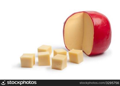 Dutch Edam cheese cubes on white background