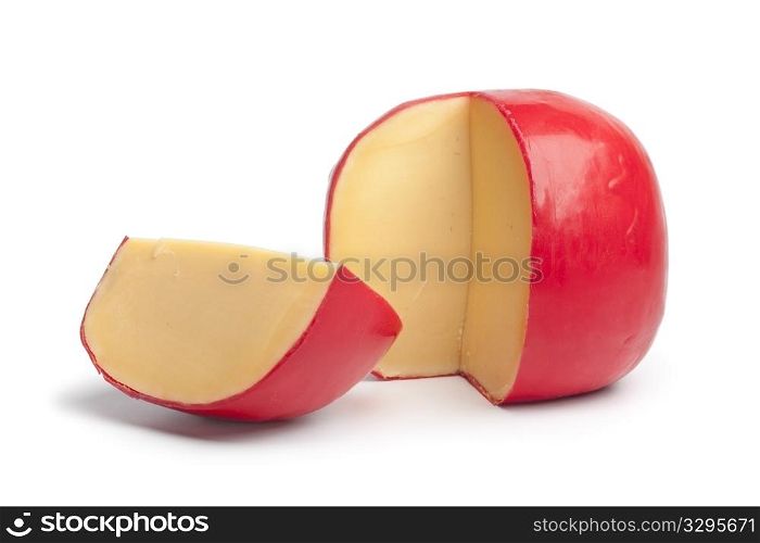 Dutch Edam cheese with a quarter on white background