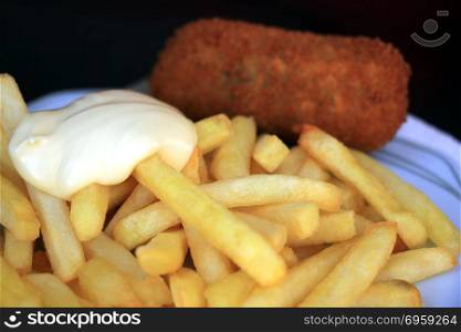 Dutch french fries: with Mayonnaise and a croquette, stuffed with meat. Dutch french fries