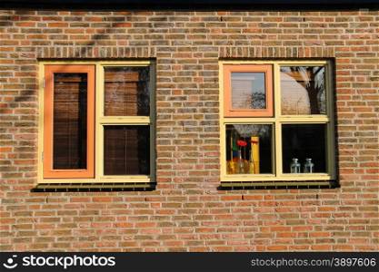 Dutch house window decoration flowers in a traditional style