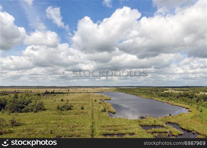 Dutch National park with heath, wetlands and a beautiful cloudy sky. Dutch National park with heath, wetlands and cloudy sky