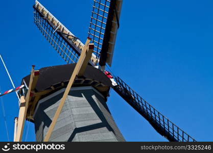 Dutch windmill in Holland with blue sky