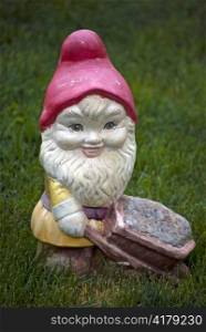 dwarf garden decorative statue on green grass