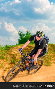 dynamic picture of a cyclist in motion on a mountain road