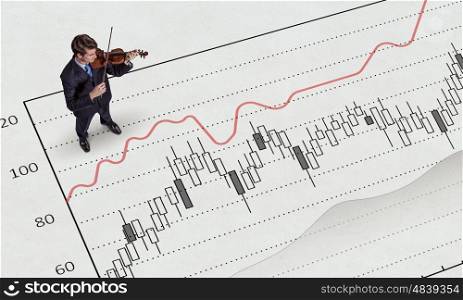Dynamics of growth in business. Top view of businessman and graphs and diagrams on floor