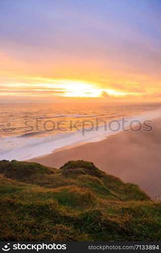 Dyrholaey rock formation at sunset. Dyrholaey is a promontory located on the south coast of Iceland, not far from the village Vik