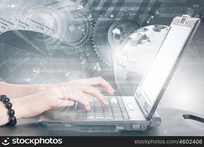 E-business concept. Hands of businessman running with fingers on laptop keyboard