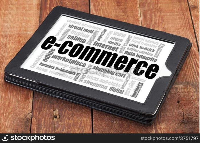 e-commerce word cloud - a digital tablet on a rustic wooden table