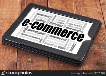 e-commerce word cloud - a digital tablet on a rustic wooden table