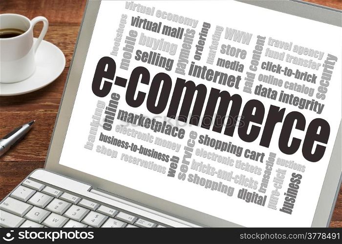e-commerce word cloud on a laptop screen with a cup of coffee - internet business concept