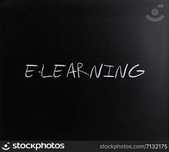 ""E-learning" handwritten with white chalk on a blackboard."