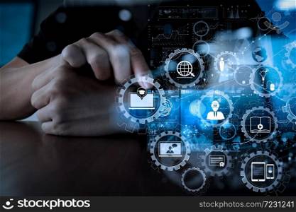 E-learning with connected gear cogs connected diagram virtual dashboard.Businessman hand using mobile phone with digital layer effect as business strategy concept