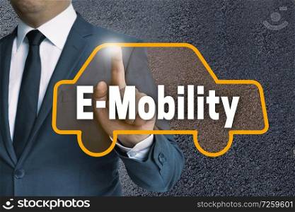 E-Mobility touchscreen is shown by businessman.. E-Mobility touchscreen is shown by businessman