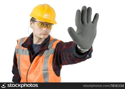 ear plugs goggels and protective gloves giving a stop sign with his hand. Clipping Path included