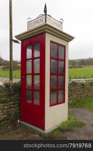 Earliest model of standard UK telephone kiosk, the K1. This is a replica after the original was accidentally destroyed during the filming of the 1986 film Comrades. Tyneham, Dorset, England, United Kingdom.