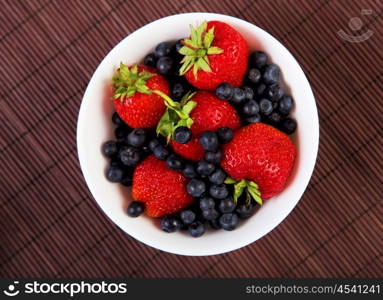 Early breakfast. Strawberries, cream and juice. The symbol of healthy lifestyles.