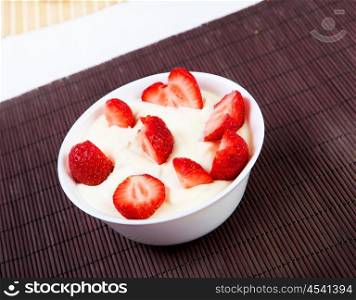 Early breakfast. Strawberries, cream and juice. The symbol of healthy lifestyles.