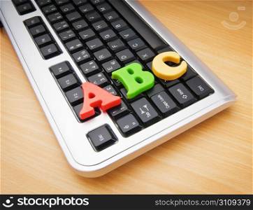 Early education concept with keyboard and letters